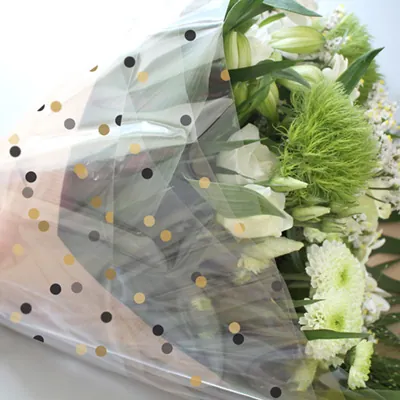 Film fleuriste - Film polypropylène à pois or et noir 80 cm x 120 m 40µ - Films polypropylène à motifs-2